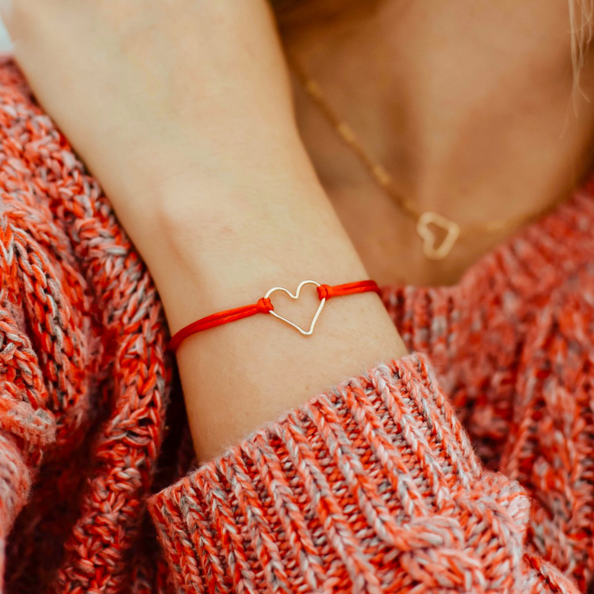 Red 'Armed with Love' Bracelet, shown on model